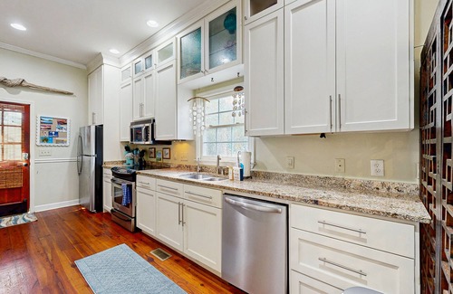 North-Central House | North Central, 30-Day Rental Home w/Double Porches, Garden Patio, and Free WiFi