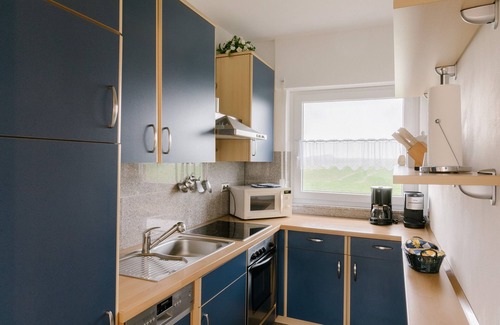 Neuharlingersiel Apartment | North Sea Oasis Pethan 1 - downstairs - non-smoking apartment with sauna - no pets