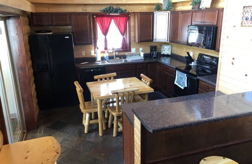 New Lisbon Cabin | Northwoods Getaway- Private swimming pond, hot tub, & 70 acres of woods