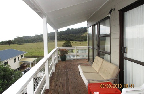 Oakura House | Oakura Lookout is a comfy bach overlooking Oakura with some water views.
