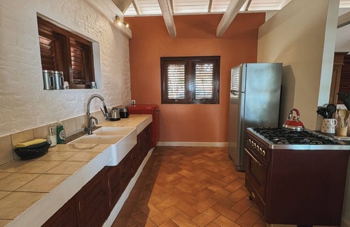 Boka Sami House | Oceanfront Caribbean styled bungalow situated on a clip above the Caribbean Sea.