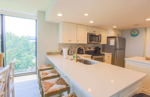 Isle of Palms Condo | Oceanfront, Renovated Corner Condo with Ocean Views, Community Pool. Yards from Beach