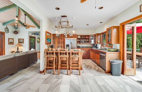 Honaunau-Napoopoo House | Oceanfront sanctuary with light-filled interior, lanai, W/D, & full kitchen