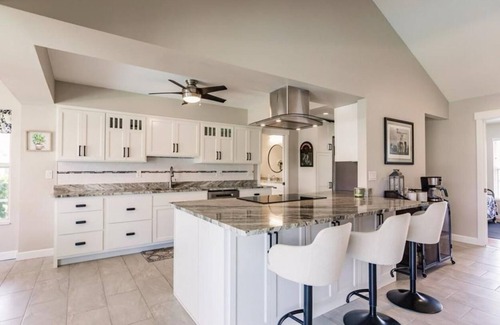 Fort Myers House | Offering breathtaking views of the sun setting over the water.