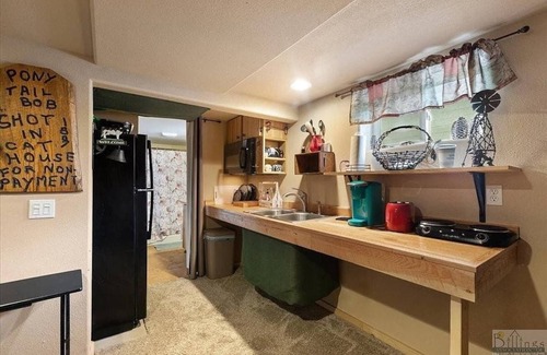 Central - Terry Condo | Old West Den - Backyard Hot Tub - Central Billings
