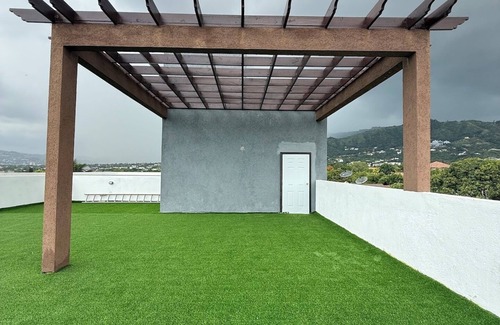 Barbican Apartment | One Bedroom Gated Apartment with rooftop terrace mountain views and pool