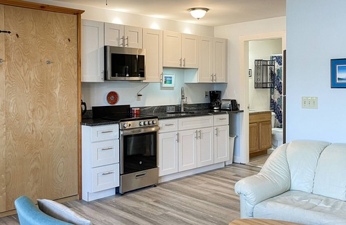 Wells Condo | Open, ground-floor condo right in town with outdoor pool, BBQ