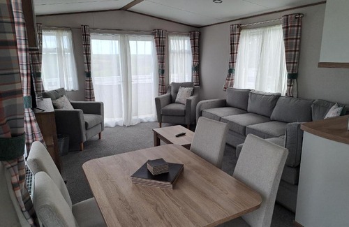 Grampound Resort | Our Kingfisher 34-4 persons with private hot tub-pet friendly-Tranquil holiday away from it all yet not far from St Austell- The Holiday Home has two bedrooms, living and dining area, equipped kitchen-Decking-outdoor furniture-Fishing lakes-Perfect