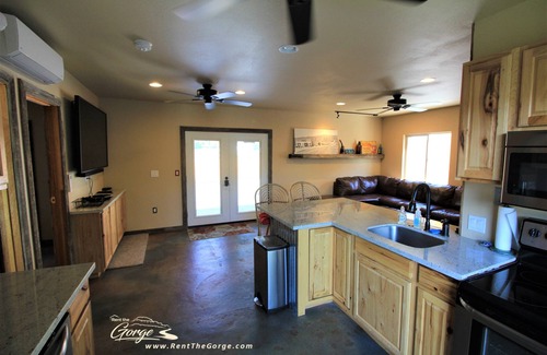 Sunland Estates House | Outdoor kitchen with grill and professional griddle