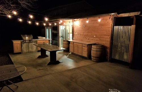 Sunland Estates House | Outdoor kitchen with grill and professional griddle