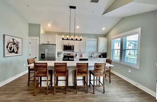 Corolla Condo | Oyster & Pearl Beautiful New Single Level Condo