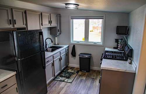 Omro House | Peaceful Riverfront - all amenities for fishing or friends/family getaway!