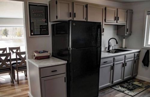 Omro House | Peaceful Riverfront - all amenities for fishing or friends/family getaway!