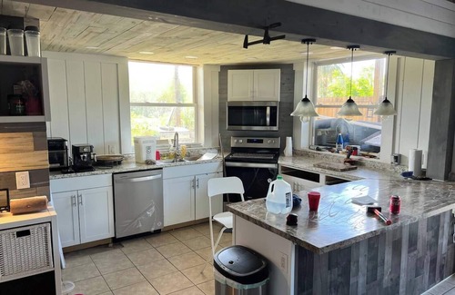 Laurel House | Peachland getaway with pool and tiki bar.
