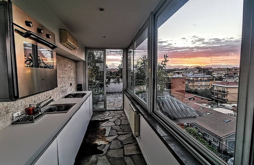 Tor di Quinto Apartment | Penthouse in picturesque Fleming where the sky merges with the beauty of Rome.