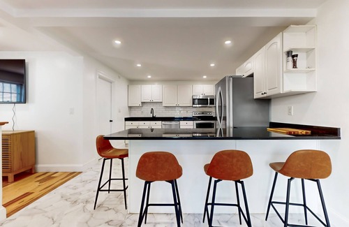 Everett House | Perfectly located modern home with smart TVs, high chair, patio, W/D, & AC