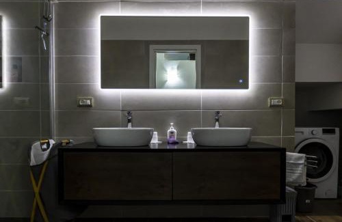 Pantai Apartment | Perla sul mare con giardino