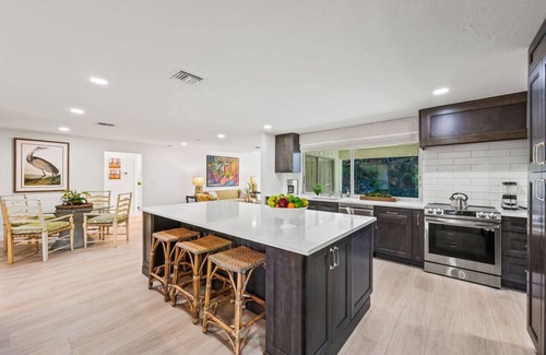 Moorings House | Pesaro Vacation Rental: Stylish 3-BR Retreat Near Via Miramar Beach. Renovated Home with Private Pool, Lush Gardens and Modern Comforts. Perfect for Families, Close to Beaches and Downtown Naples!