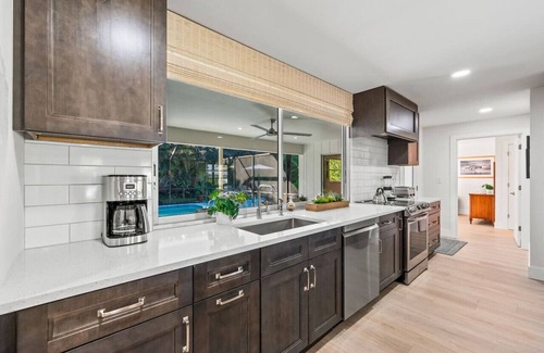 Moorings House | Pesaro Vacation Rental: Stylish 3-BR Retreat Near Via Miramar Beach. Renovated Home with Private Pool, Lush Gardens and Modern Comforts. Perfect for Families, Close to Beaches and Downtown Naples!