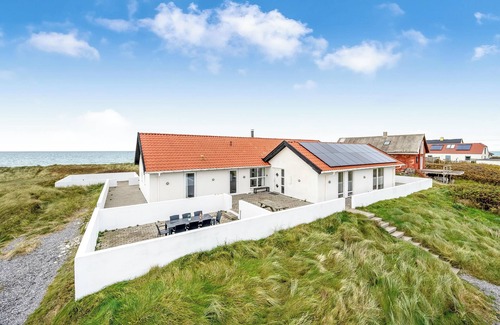 Lild Strand House | Pool and activity house with a 180-degree view of the North Sea, located at.