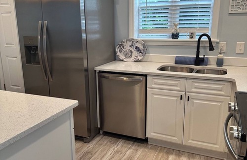 Southport Condo | POOL AND PICKLEBALL! Perfectly located 1st floor condo, close to everything