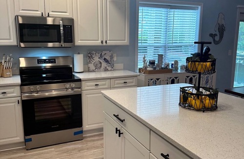 Southport Condo | POOL AND PICKLEBALL! Perfectly located 1st floor condo, close to everything