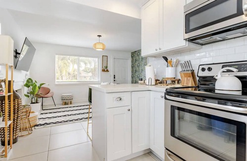 Lake Worth Cottage | Pool, Hot tub, 5 min to beach! The Monkey Cottage!