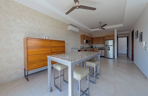 North Hotel Zone Condo | Porto Santo beautiful 1 bedroom flex, king bed+sofa bed steps from playa de oro.