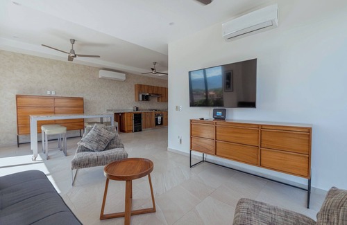 North Hotel Zone Condo | Porto Santo beautiful 1 bedroom flex, king bed+sofa bed steps from playa de oro.