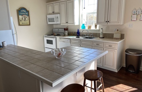 Waveland House | Pretty raised three bedroom beach home awaits you! A short 3 min. walk to beach!