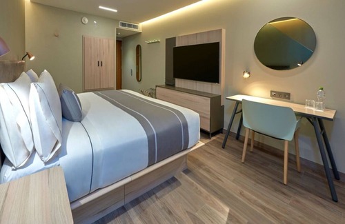 Providencia Hotel | Prime Location in Trendy Zone – Modern Room, Work Desk, and Local Charm