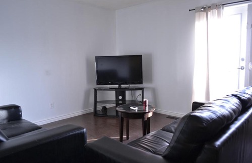 Southeast Calgary House | Private bedroom on renovated duplex main floor - Dover