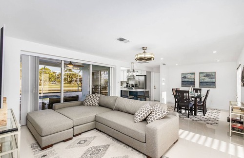 Caloosahatchee House | Private enclosed heated pool with Gulf access. Panoramic Lenai