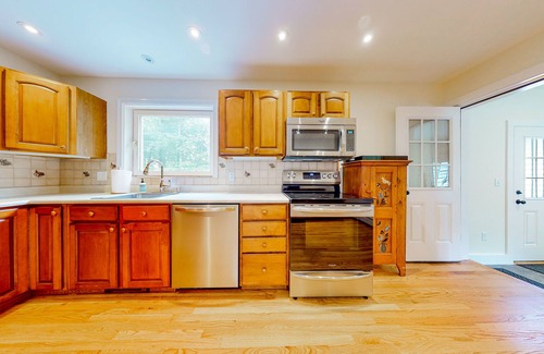 Manchester House | Private home with fireplace, grill, games, AC & great Manchester location