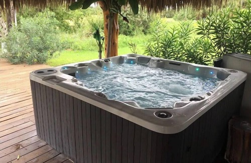 Galveston House | Private Hot Tub with outdoor shower and tiki area to relax and Enjoy!