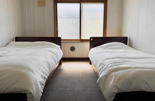 Tobetsu Apartment | Private house Oheso 40minutes from Sapporo,4 free parking, long stay,16people