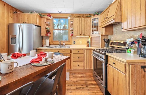 Presque Isle Cabin | Private Lakefront Stay with Beautiful Sunset Views, Kayaks, & Kid’s Arean