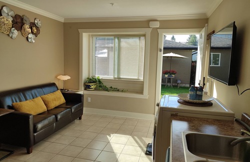 Metrotown Apartment | Private Suite with King Bed. Ground Level