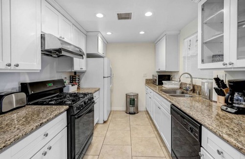Azusa House | Quaint City Haven: 2-Bedroom Retreat with Free Laundry Access, Private Parking Bliss, and Blazing Internet.