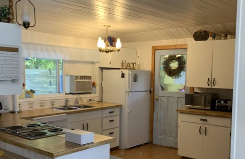 Christina Lake Cottage | Quaint Lakefront cottage that sleeps 10. Deck, hot tub and large fenced yard.