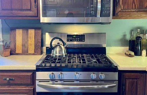 Asheville House | Quiet bungalow in west Asheville with hot tub, fitness room, and a wood stove.