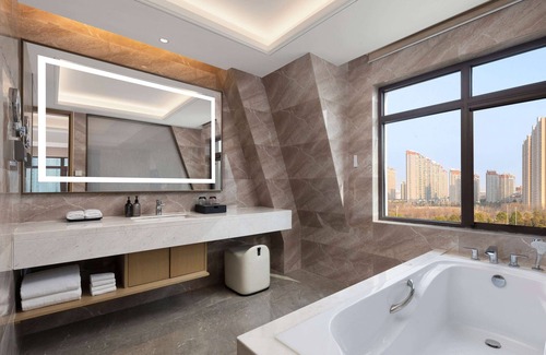 Yicheng District Hotel | Ramada by Wyndham Zhumadian West Station