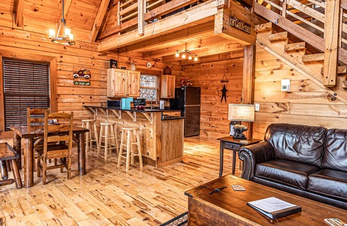 Bryson City Cabin | Real log cabin near Nantahala rafting! Hot tub, easy access, & game room.