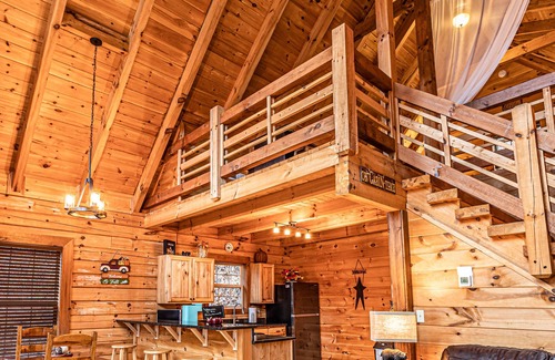 Bryson City Cabin | Real log cabin near Nantahala rafting! Hot tub, easy access, & game room.
