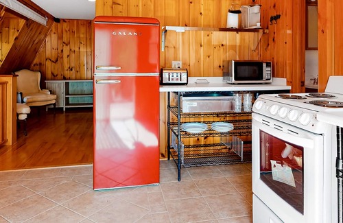 Sandgate Apartment | Red barn retreat with river views, hot tub, deck, firepit, & large yard
