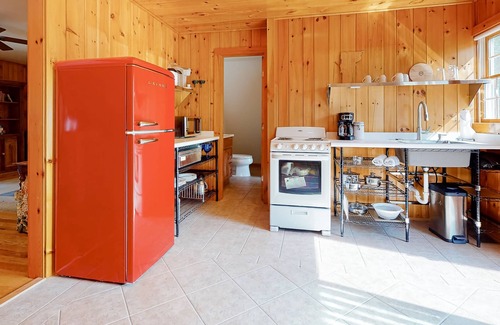 Sandgate Apartment | Red barn retreat with river views, hot tub, deck, firepit, & large yard