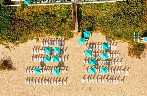Palm Beach House | Relax and Recharge! Beachfront Accommodations | Garden View Room