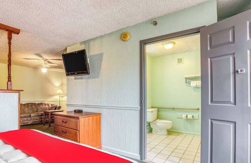South Tulsa Hotel | Relax and Recharge in a Quiet Room w/King Bed + Handy Mini Fridge Setup