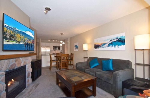 Village North Condo | Relax and Watch the activity of the Village on the oversized patio. Professionally Managed.