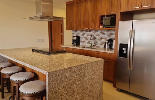 Libertad Apartment | Relax in a Beautiful Condo w/Pool, Gym, Firepit and Partial City and Bay Views